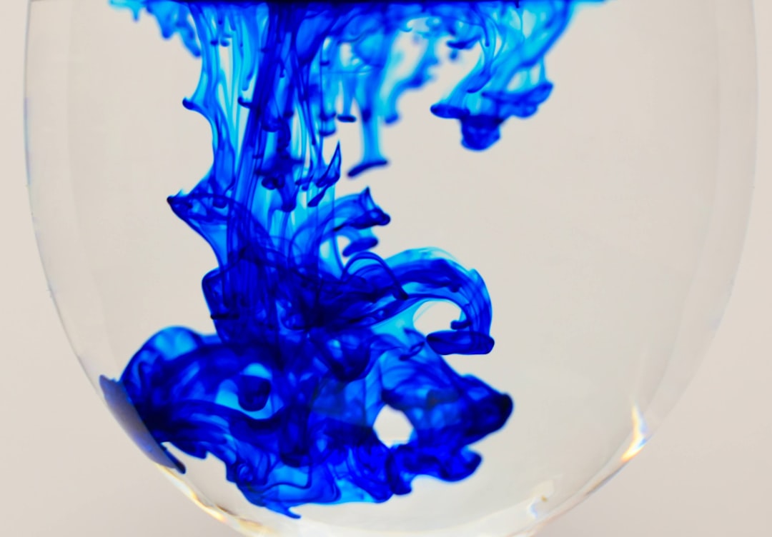 a-close-up-of-a-blue-liquid-in-a-glass-fcaibz1qxhw